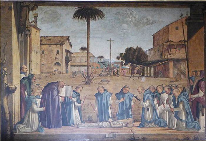 Das in der Scuola di San Giorgio degli Schiavoni in Venedig ausgestellte Bild zeigt trauernde Klosterbrüder, die mit Totenkerzen neben dem ausgezehrten am Boden liegenden Leib des 98jährig verstorbenen heiligen Hieronymus knien